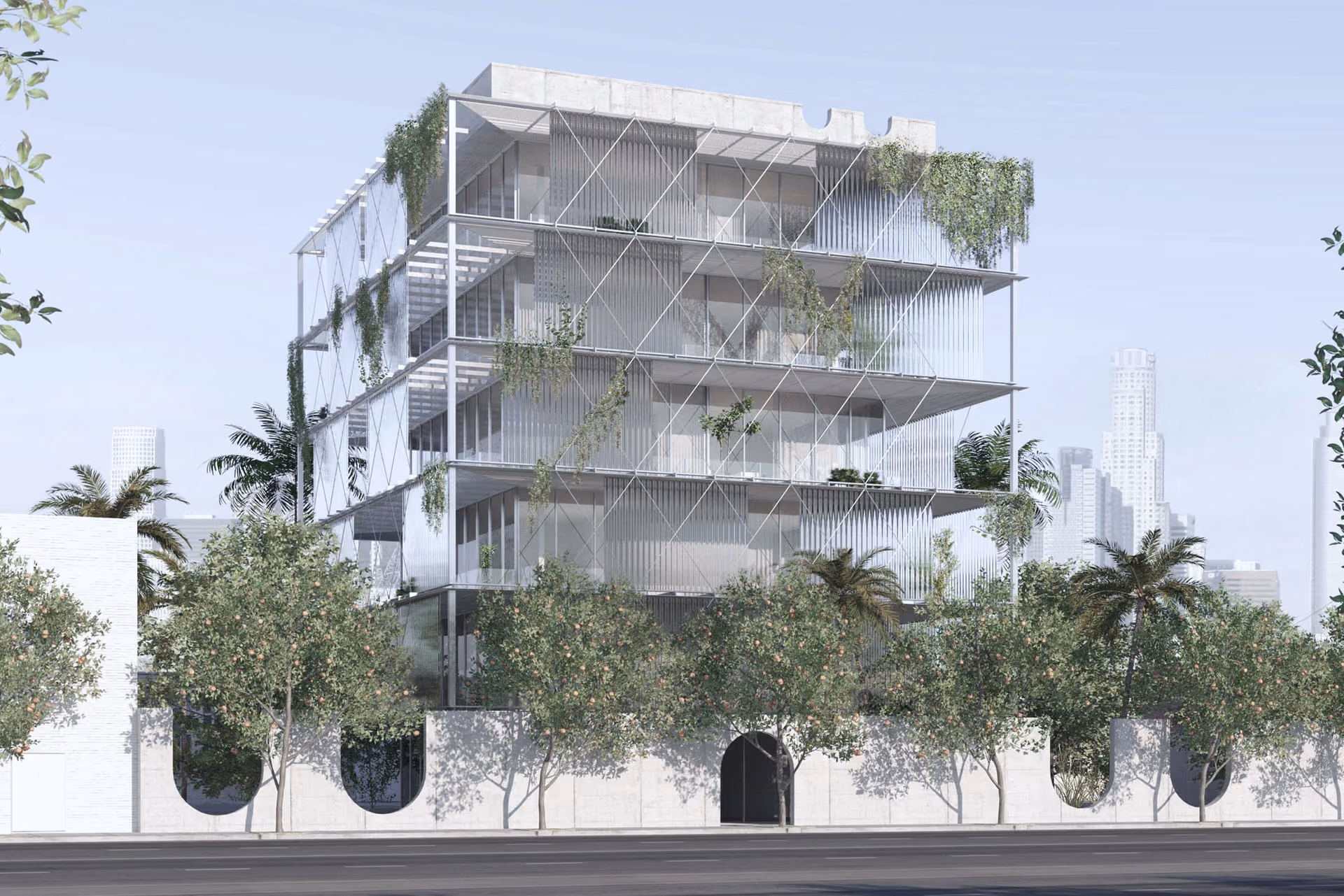 A seven-storey building of steel, glass and fins behind a garden wall